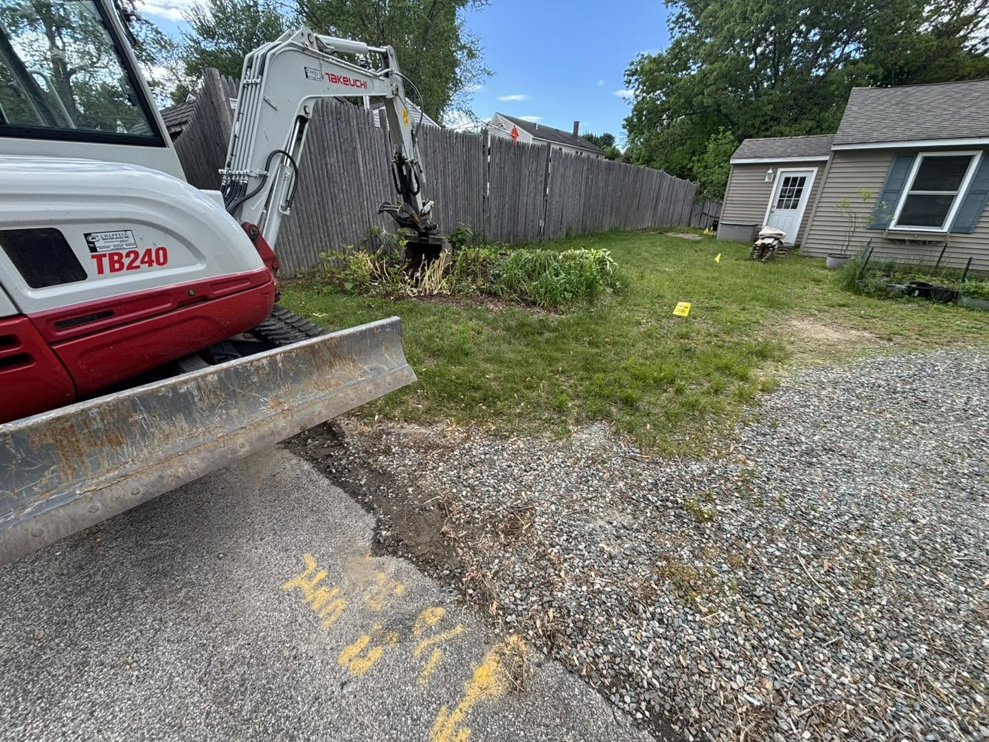 Excavating contractor Hampton, NH — Yianni Birmbas Excavation equipment Compact excavator on a residential job site for excavating contractor Hampton, NH